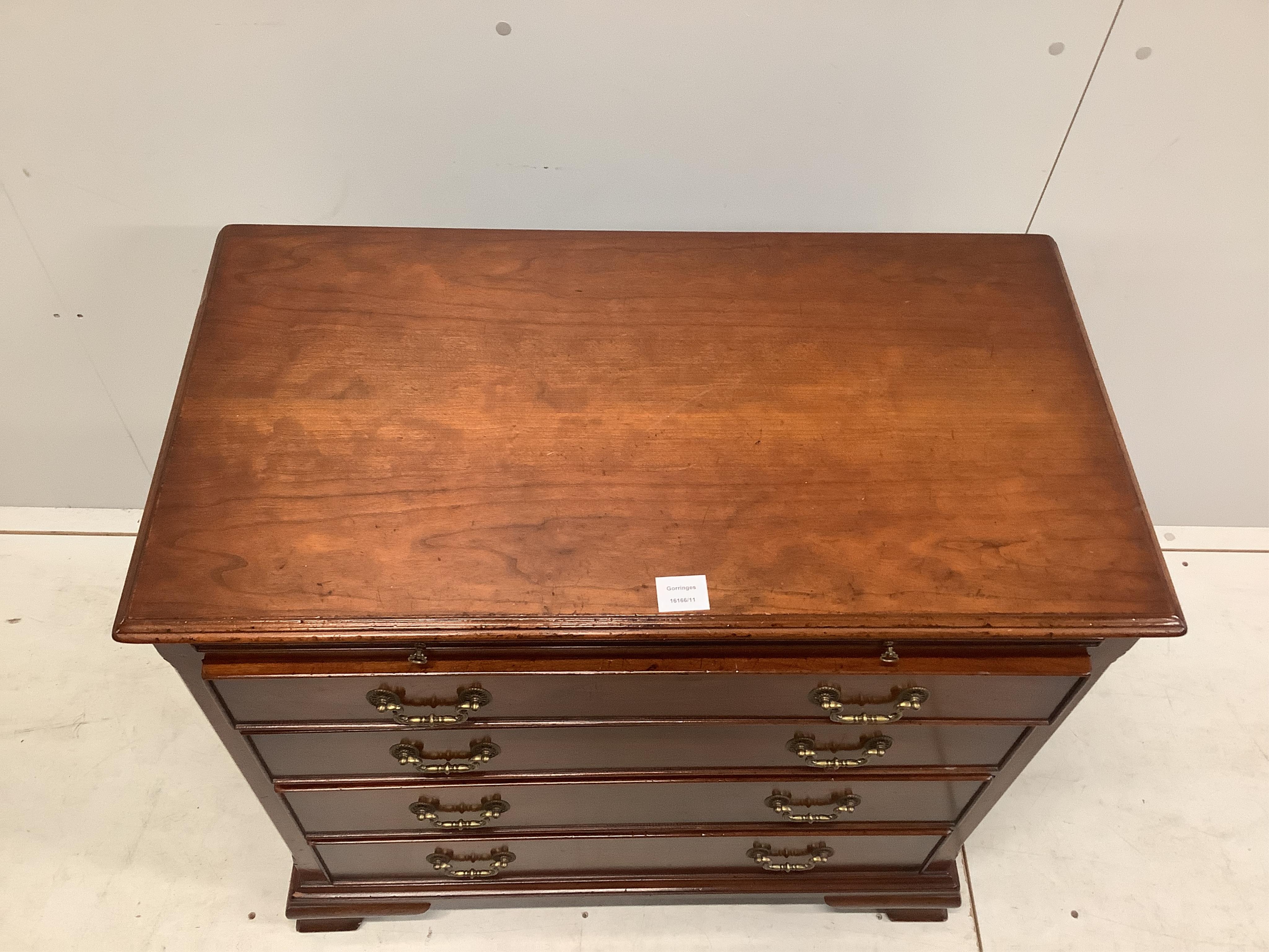 A George III style mahogany chest, fitted four long drawers, beneath a brushing slide, width 84cm, depth 45cm, height 80cm. Condition - good